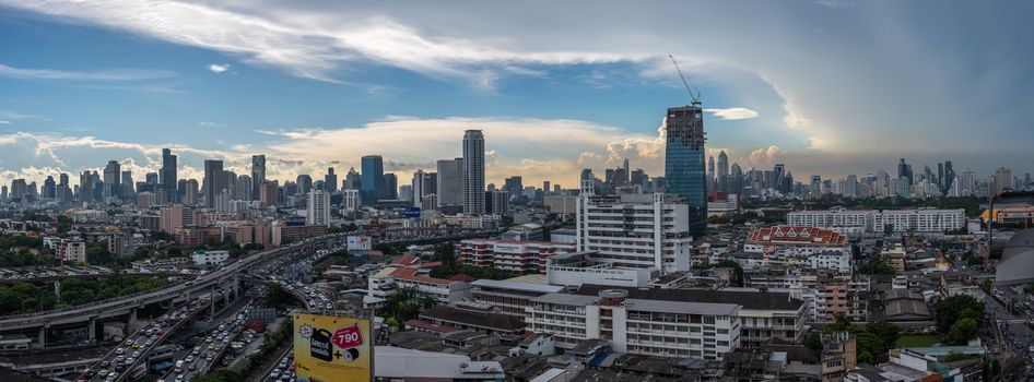 Bangkok, Thailand - May 25, 2018 : Panorama cityscape and transportation with expressway traffic in daytime from skyscraper of Bangkok. Bangkok is the capital and the most populous city of Thailand.