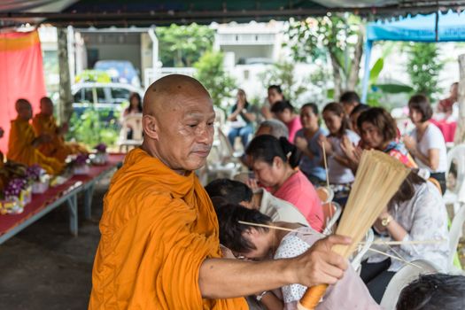 Bangkok, Thailand - April 29, 2018 : Unidentified thai monk praying and bless by holy water for religious ceremony in buddhist belief at Thai temple (Wat Thai)