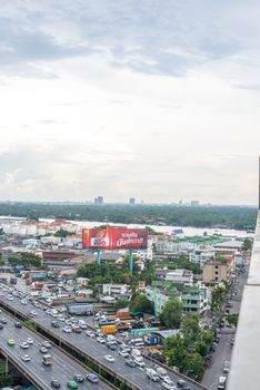 Bangkok, Thailand - May 26, 2018 : Cityscape and building of city in storm clouds sky from skyscraper of Bangkok. Bangkok is the capital and the most populous city of Thailand.