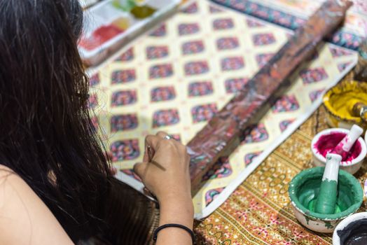 Bangkok, Thailand - June 16, 2018 : Unidentified Thai artist drawing a striped Thai art for making Thai silk design by Ayutthaya traditional contemporary fashion