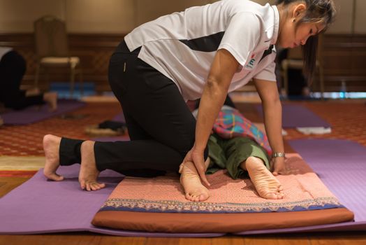 Bangkok, Thailand - June 18, 2018 : Unidentified Thai woman to take of service Thai traditional massage for treat aches and pains.