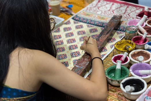 Bangkok, Thailand - June 16, 2018 : Unidentified Thai artist drawing a striped Thai art for making Thai silk design by Ayutthaya traditional contemporary fashion