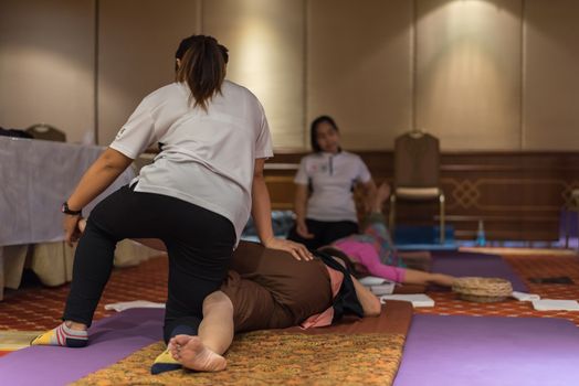 Bangkok, Thailand - June 18, 2018 : Unidentified Thai woman to take of service Thai traditional massage for treat aches and pains.