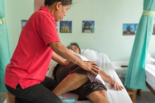 Ang Thong, Thailand - August 13, 2018 : Unidentified Thai woman to take of service Thai traditional massage for treat aches and pains.