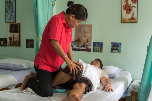 Ang Thong, Thailand - August 13, 2018 : Unidentified Thai woman to take of service Thai traditional massage for treat aches and pains.