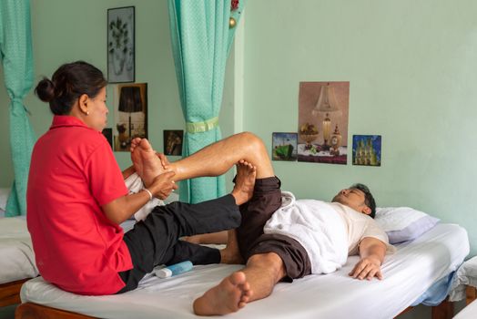 Ang Thong, Thailand - August 13, 2018 : Unidentified Thai woman to take of service Thai traditional massage for treat aches and pains.