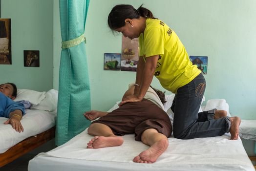 Ang Thong, Thailand - August 12, 2018 : Unidentified Thai woman to take of service Thai traditional massage for treat aches and pains.