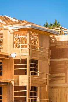 Apartment building under construction on sunny day on blue sky background