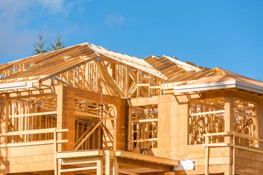 New apartment building under construction on sunny day on blue sky background