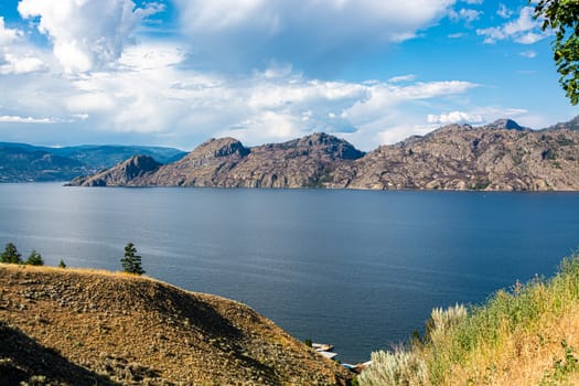 Beautiful afternoon overview of the lake and rocky mountains in British Columbia