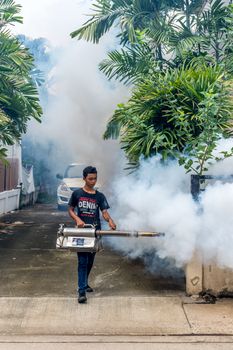 Bangkok, Thailand - July 3, 2016 : Unidentified people fogging DDT spray kill mosquito for control Malaria, Encephalitis, Dengue and Zika in village at Bangkok Thailand.