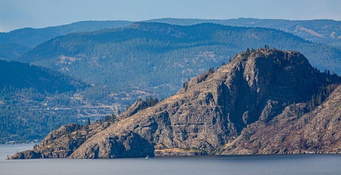 Scenery view of rocky mountain slope over the lake in British Columbia