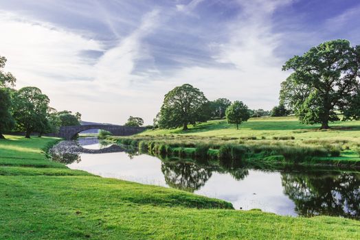 Bridge in Dallam Park, Milnthorpe, Cumbria passing over the river Bela