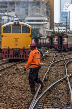 Bangkok, Thailand - August 11, 2016 : Unidentified railway employees working for restoration the railroad tracks before serving at State Railway of Thailand.