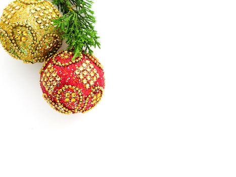 red and gold Christmas balls with glittering golden beads and glasses, isolated on white background