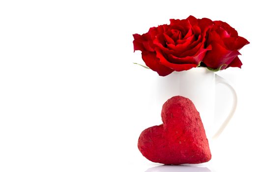 Blooming red roses and red paper mache heart, isolated on white background. Love, romance, Valentine's Day.