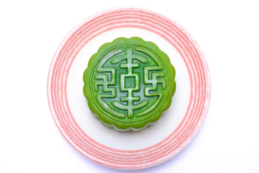 chinese traditional pastry on a white ceramic plate, with non-traditional green tea flavor