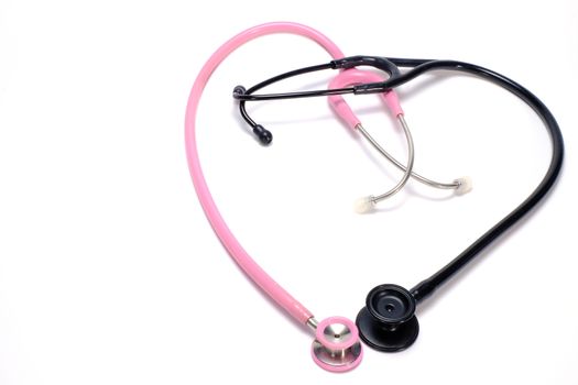 2 stethoscopes, pink and black, arranged into heart shape symbol on a white background