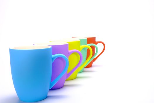 colorful coffee mugs isolated on white background
