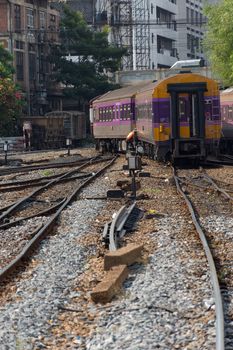 Bangkok, Thailand - May 19, 2016 : Unidentified railway train on the railroad tracks in Bangkok station. Many people in Thailand popular travel by train because it is cheaper.