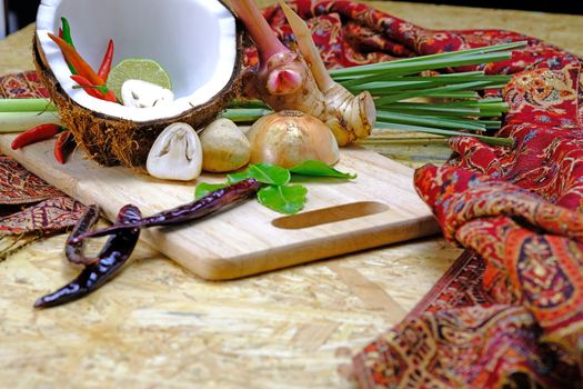 ingredients for preparing famous Thai Chicken Coconut Soup
(Tom Kha Gai) ' include coconut milk, shallot, galangal, lemon grass, red chilies, kaffir lime leaves, boneless chicken breast, lime juice