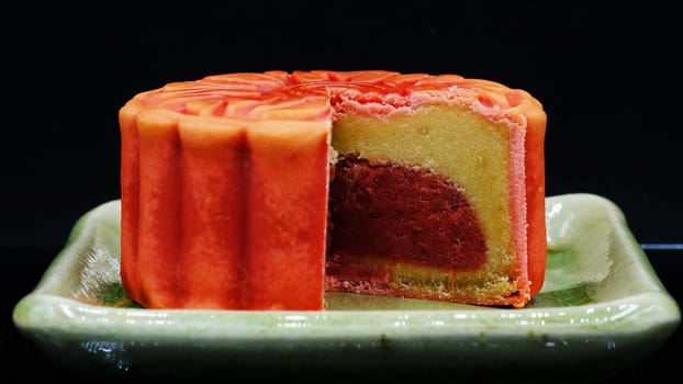 moon-cake, a traditional chinese dessert made of pastry with sweet cranberry and bean paste fillings