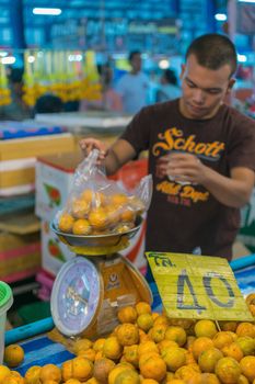 Bangkok, Thailand - January 28, 2016 : Thai street food with orange in market.