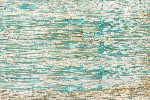 An old painted wood panel in greenish blue color. Background texture.