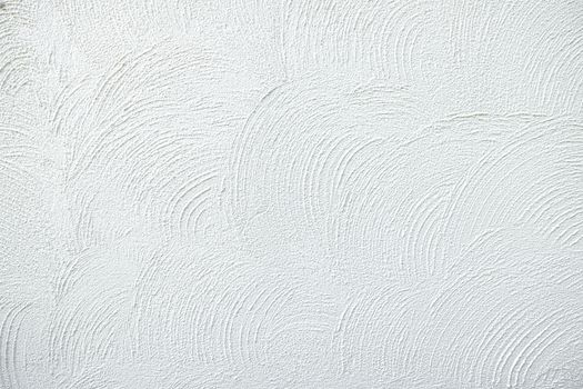 White plaster textured background.