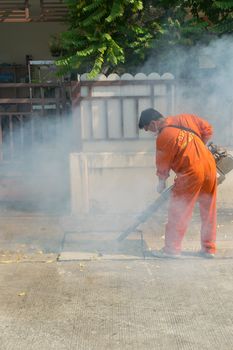 Bangkok, Thailand - January 31, 2016 : Unidentified people fogging DDT spray kill mosquito for control Malaria, Encephalitis, Dengue and Zika in village at Bangkok Thailand.