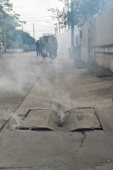 Bangkok, Thailand - January 31, 2016 : Unidentified people fogging DDT spray kill mosquito for control Malaria, Encephalitis, Dengue and Zika in village at Bangkok Thailand.