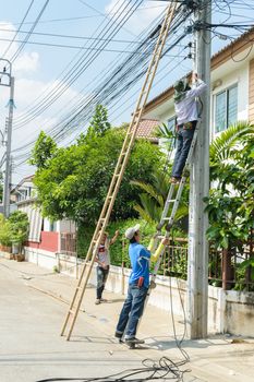 Bangkok, Thailand - October 17, 2015 : Unidentified worker working to install CCTV system in village at Bangkok Thailand.