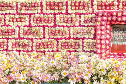 Closeup details of intricate patterns of flowers on floats used in the February Flower Festival Parades in the City of Chiangmai, Thailand. Fresh flowers are used to creat the beautiful float.