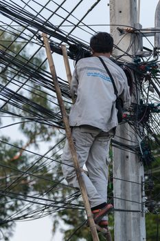 Bangkok, Thailand - November 16, 2015 : Unidentified worker working to install internet fiber system in village at Bangkok Thailand.