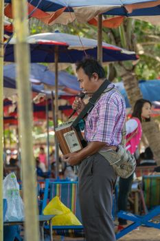 Rayong, Thailand - December 31, 2015 : Unidentified people blind sing a song at LaemMaePhim beach.