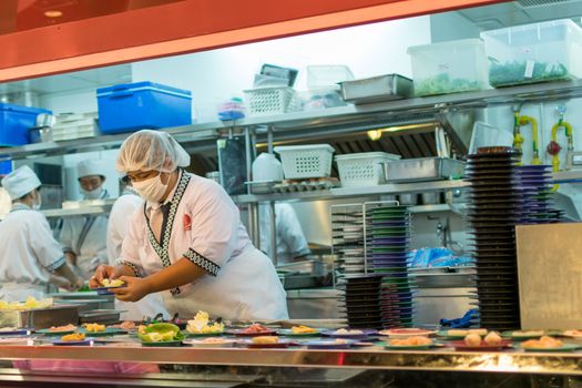 Bangkok, Thailand - December 30, 2015 : Unidentified chefs cooking in the Japan restaurant Kitchen