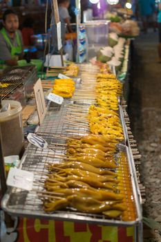 Bangkok, Thailand - January 9, 2016 : Thai exotic food in street food market with seafood grilled squid. Like the charming people, exotic foods greets you on almost every corner in Thailand.