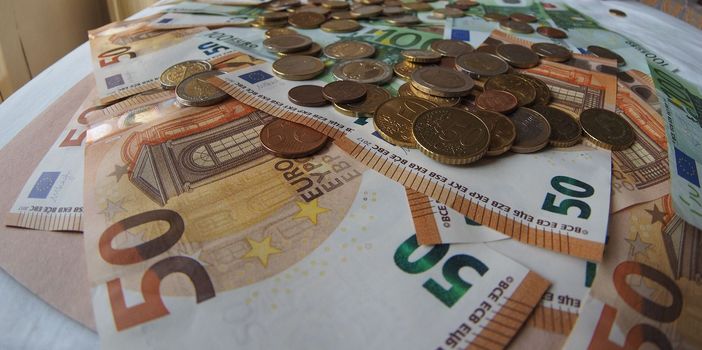 50 and 100 Euro banknotes money (EUR), currency of European Union, seen with fisheye lens