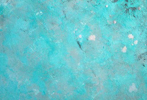 Concrete emerald green background with scuffs and black splashes. Textured wall texture in the grunge style.