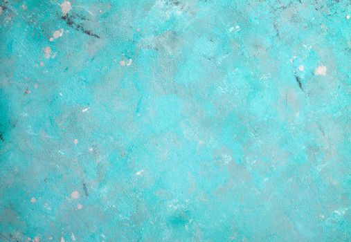 Concrete emerald green background with scuffs and black splashes. Textured wall texture in the grunge style.