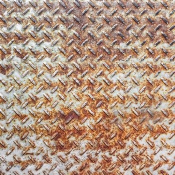 Background of old metal diamond plate in brown color