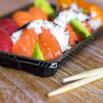 Macro shot of sushi and sashimi. Typical Japanese dish. Concept: Japanese restaurant, sushi, oriental tradition.