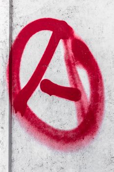 Anarchy graffiti. Anarchy symbol sprayed on the wall. Rejection of the hierarchy.