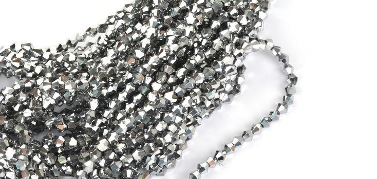 Beautiful color silver gray Glass Sparkle Crystal Isoalted Beads on white background. Use for diy beaded jewelry