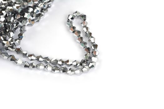 Beautiful color silver gray Glass Sparkle Crystal Isoalted Beads on white background. Use for diy beaded jewelry
