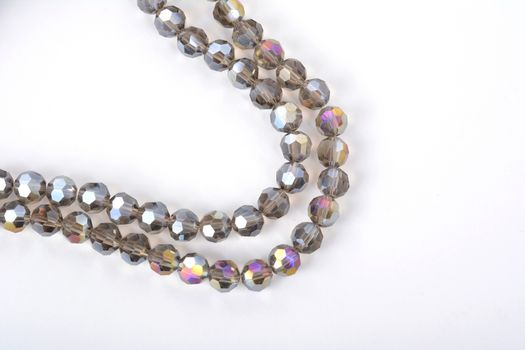 Beautiful color silver gray Glass Sparkle Crystal Isoalted Beads on white background. Use for diy beaded jewelry