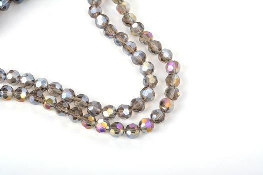 Beautiful color silver gray Glass Sparkle Crystal Isoalted Beads on white background. Use for diy beaded jewelry