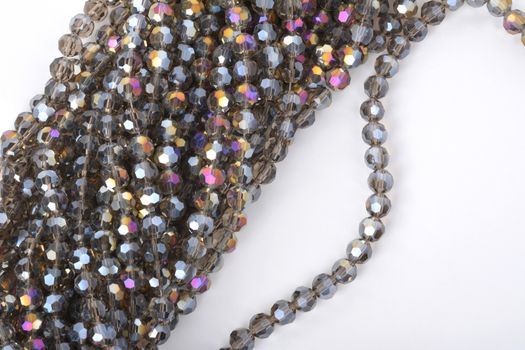 Beautiful color silver gray Glass Sparkle Crystal Isoalted Beads on white background. Use for diy beaded jewelry