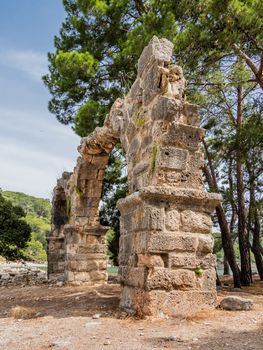 Ruins of large bath in ancient Phaselis city. Famous architectural landmark, Kemer district, Antalya province. Turkey.