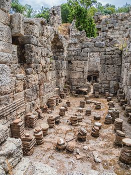 Ruins of large bath in ancient Phaselis city. Famous architectural landmark, Kemer district, Antalya province. Turkey.